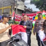 Kapolsek Simpang Kiri Ikuti Kegiatan Gerakan Nasional Pembagian Bendera Merah Putih