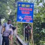 Pemasangan Spanduk Satlantas Polres Aceh Jaya: Upaya Pencegahan Lakalantas di Puncak Gunung Geurute